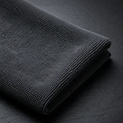 Macro view of the HexaGloss 300 GSM charcoal pearl-weave leveling towel