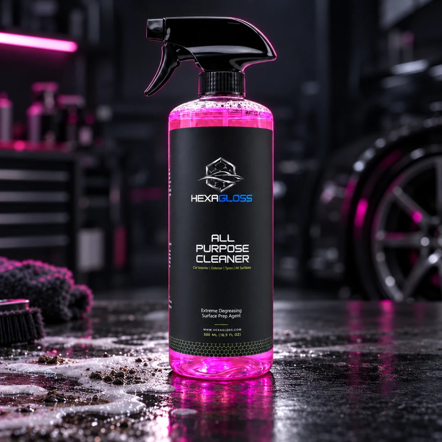HexaGloss All-Purpose Cleaner with trigger sprayer in a professional automotive detailing studio